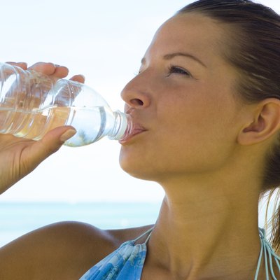 Young Woman Drinking Water from a Bottle