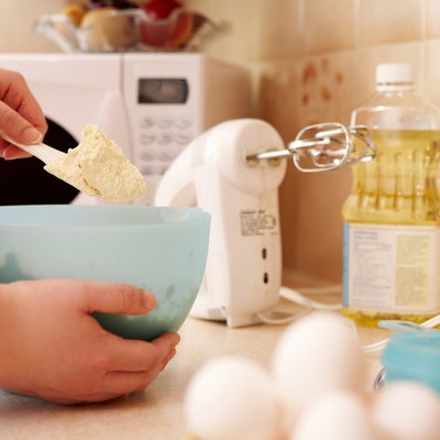 Mixing batter with spatula in bowl
