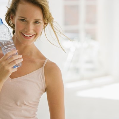 Woman holding bottled water
