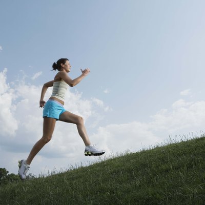 Woman running on hillside