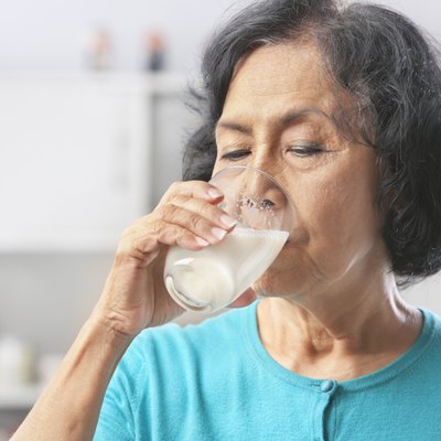 Senior woman drinking milk