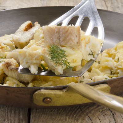 smoked eel and scrambled eggs in a pan