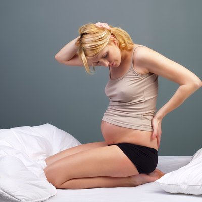 Young tired pregnant woman