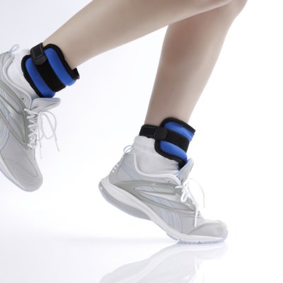 Woman jogging wearing ankle weights, detail