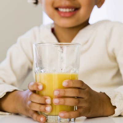 Girl with glass of orange juice