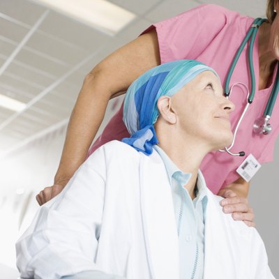 Medical Staff Pushing Patient in Wheelchair