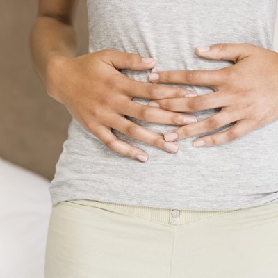 Woman holding stomach