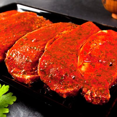 fillets marinated pork loin ready to cook.