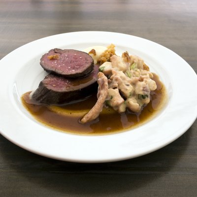 Grilled saddle of deer, grilled octopus, dressing of orange and pink ginger