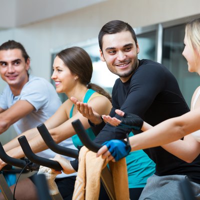 People training on exercise bikes