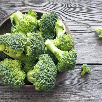 Raw broccoli on wooden background