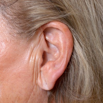 Close up of the ear of an elderly woman