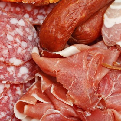 assorted sliced meat delicacies on plate