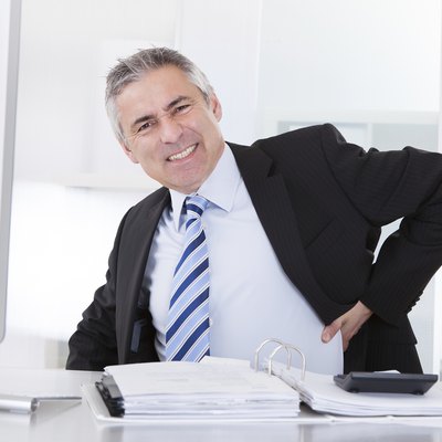 Mature Businessman With Back Pain