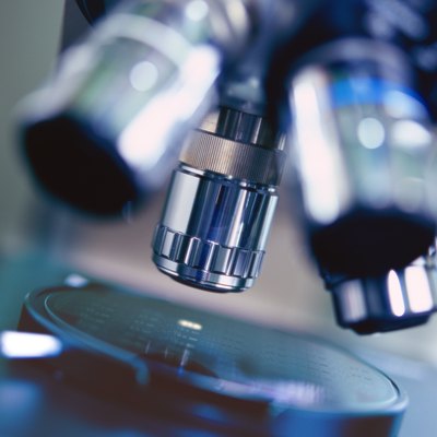 close-up of the lenses of a microscope