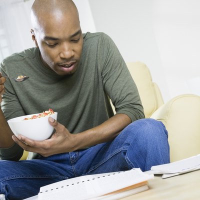African American man eating cereal