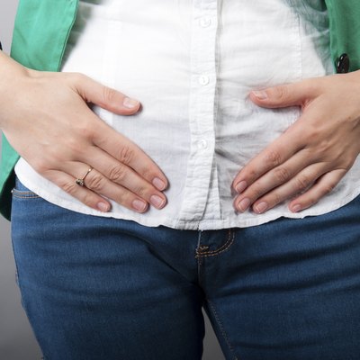 Businesswoman with abdominal pains