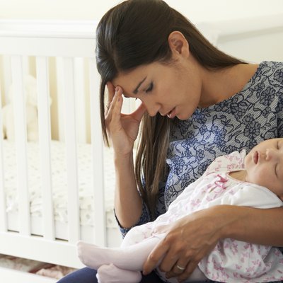 Tired Mother Suffering From Post Natal Depression