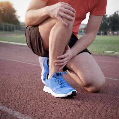 Runner with injured ankle on the track