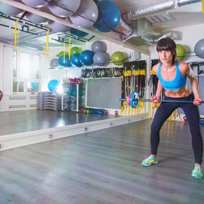 Pulling barbell on a gym