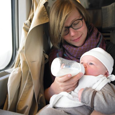 Mother Feeding Baby on Train