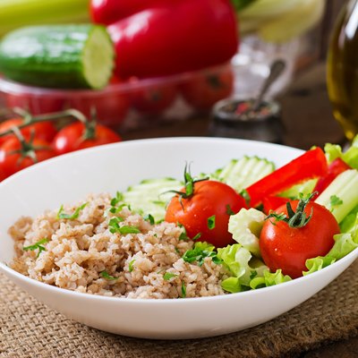 Porridge with fresh vegetables and lettuce. Healthy breakfast
