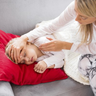 Mother with her sick child at home