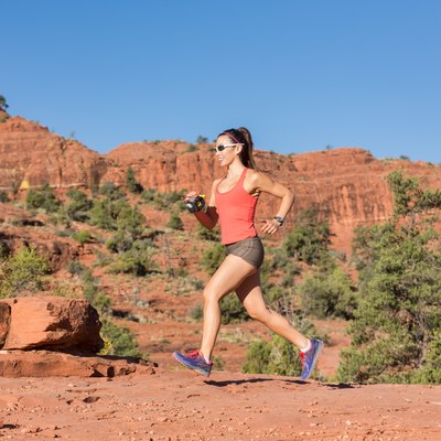 Woman Running Outdoors Uphill