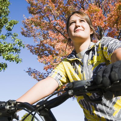 Low angle view of a woman riding a mountain bike