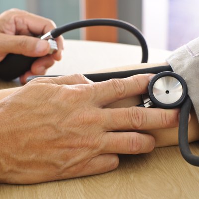 Doctor measuring blood pressure