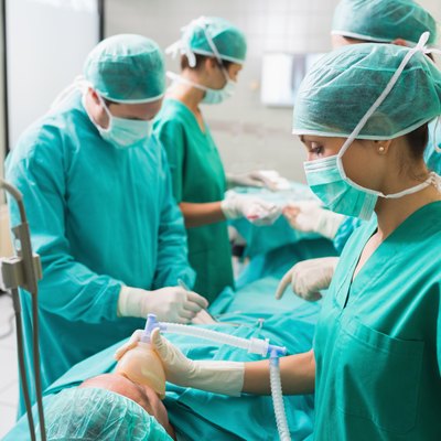 View of a nurse holding an oxygen mask