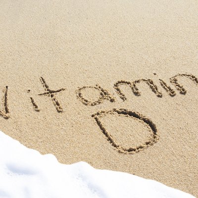Vitamin D written in the sand
