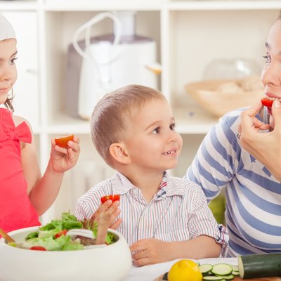 Family Eating Vegetable Salad