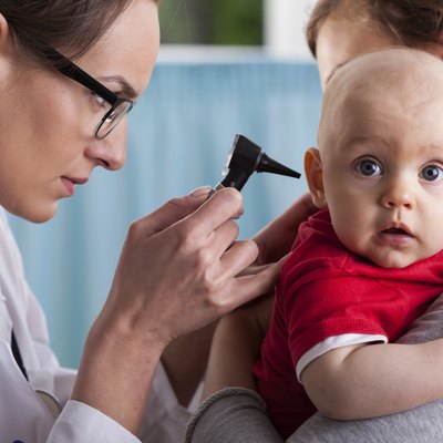 Child's otolaryngologist doing ear examination