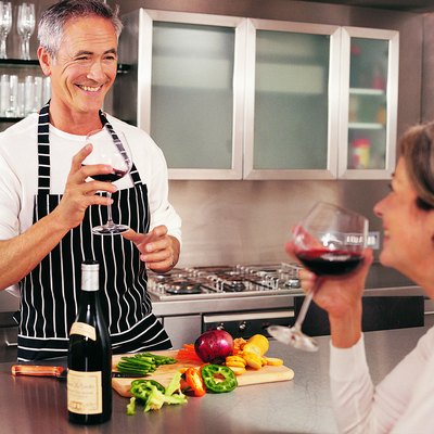 Mature Couple Drinking Wine in Their Kitchen