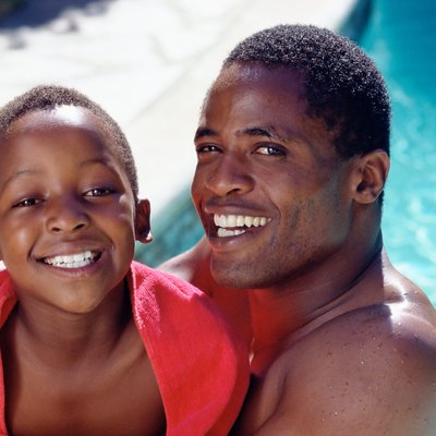Father and son by pool