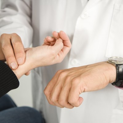 Doctor taking patient' || chr(39) || 's pulse.
