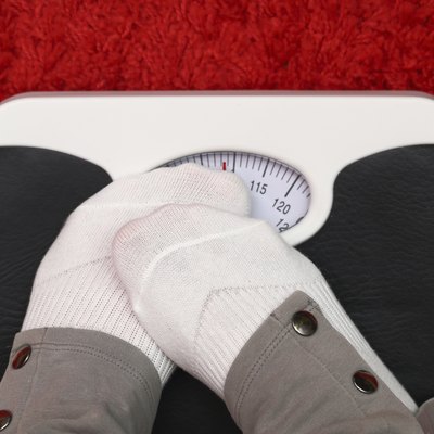 Female feet on bathroom scale