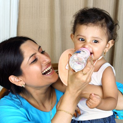 Close up of a mother feeding her child