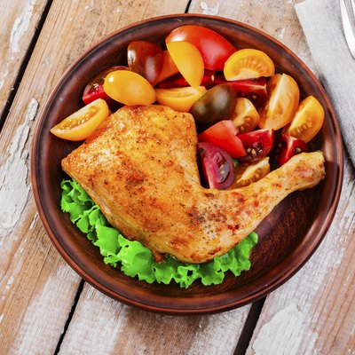 baked chicken leg with tomatoes