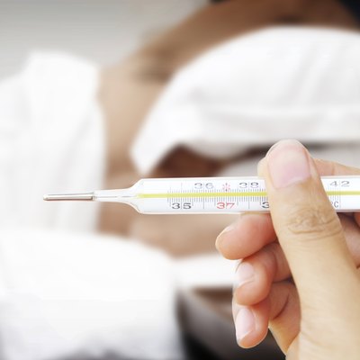 doctor hand hold thermometer