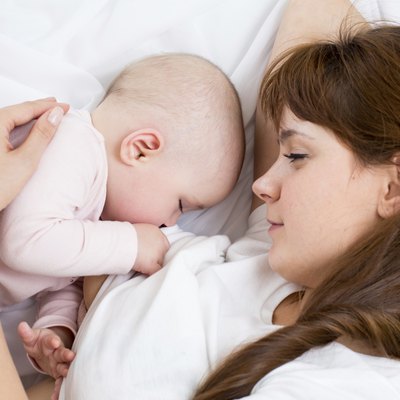 mother breast feeding her child