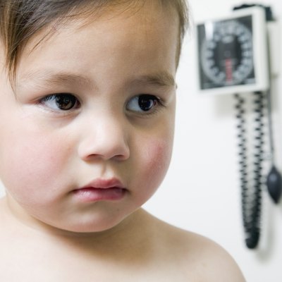 Baby boy sitting in a doctor's office