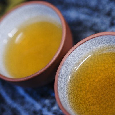 Hot tea served in Asian style teacups.