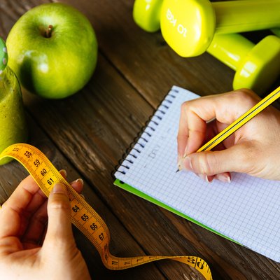 Fitness diet and nutrition routine concept with green detox smoo
