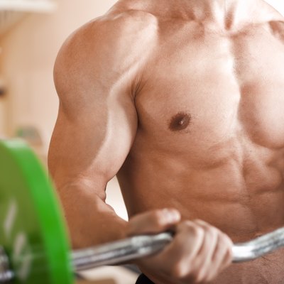 muscular man lifting barbell