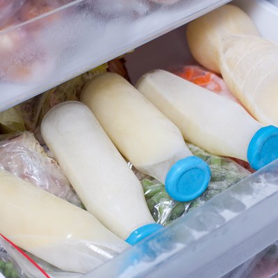 Milk in glass bottle in the refrigerator
