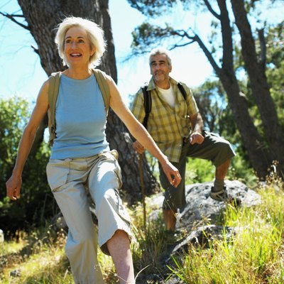 front view of mature man and mature woman walking in countryside