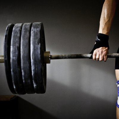 Man practising weightlifting III