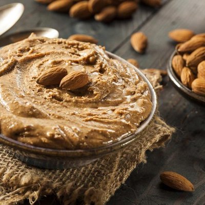 Raw Organic Almond Butter on a Background